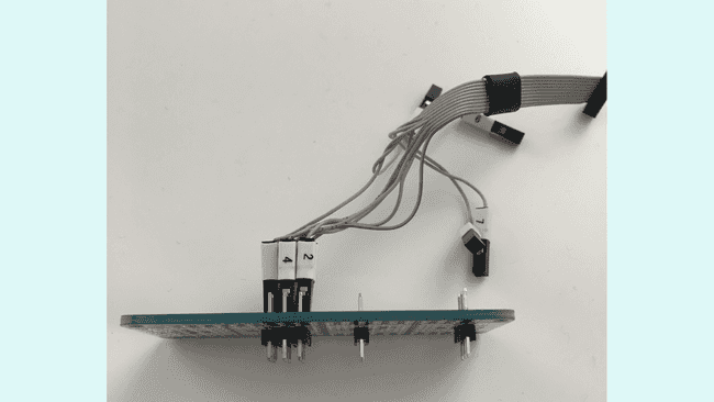 A MKR Proto Shield and 6 2.54mm straight male headers used to access the exposed pads of the board.